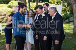 Photographer reviewing photographs on digital camera