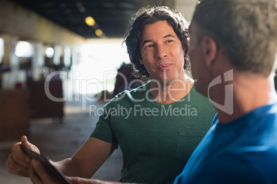Two male friends using digital tablet Two male friends using digital tablet