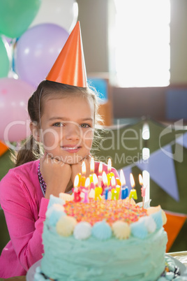 Birthday girl with cake at home