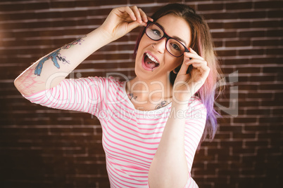 Portrait of smiling woman holding spectacles