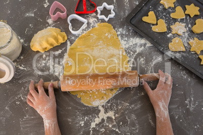 Cropped hands of boy preparing cookies