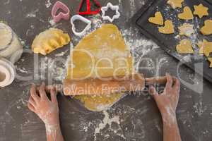 Cropped hands of boy preparing cookies
