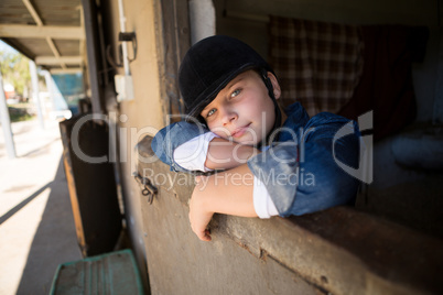 Girl relaxing in the stable