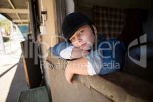 Girl relaxing in the stable