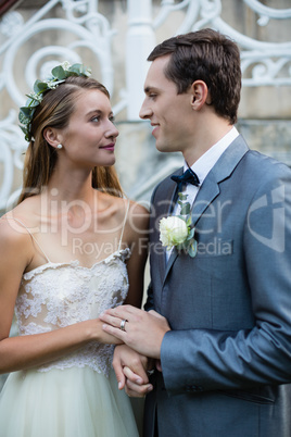 Wedding couple standing face to face