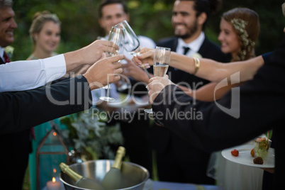 Guests toasting glasses of champagne