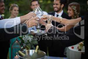 Guests toasting glasses of champagne