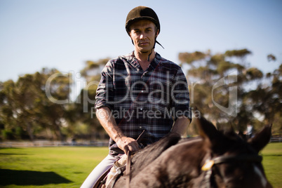 Man riding a horse in the ranch