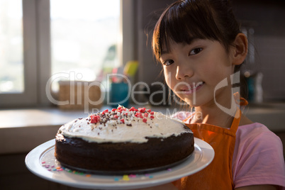 Portrait of girl with cake