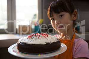 Portrait of girl with cake