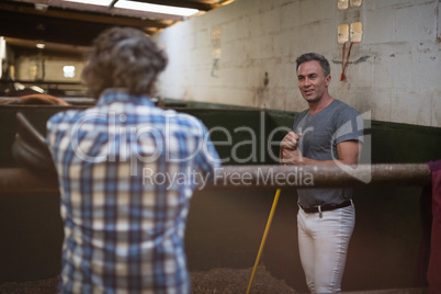 Two men interacting with each other while working