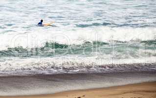Surfer enjoys the waves of the ocean