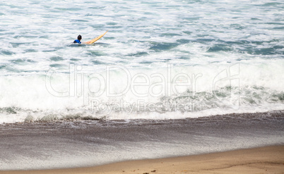 Surfer enjoys the waves of the ocean