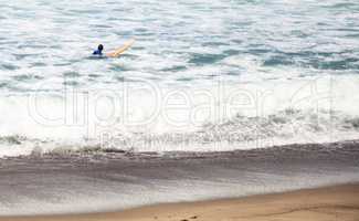 Surfer enjoys the waves of the ocean