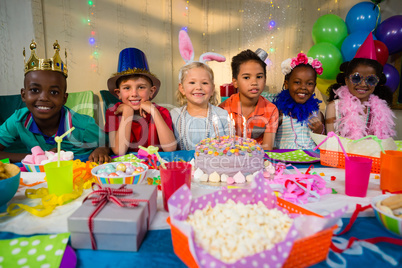 Portrait of smiling children at table