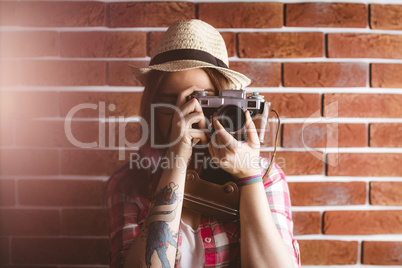 Woman photographing from vintage camera