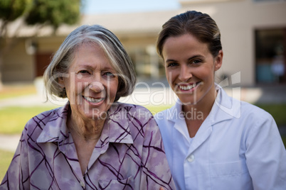 Portrait of smiling doctor and senior woman