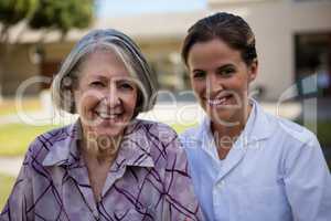 Portrait of smiling doctor and senior woman
