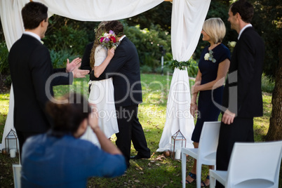 Couple embracing each other during wedding