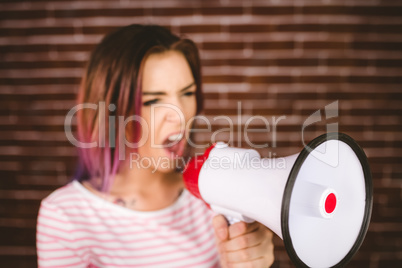 Woman shouting on megaphone