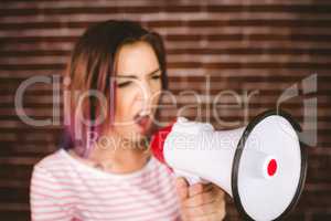 Woman shouting on megaphone