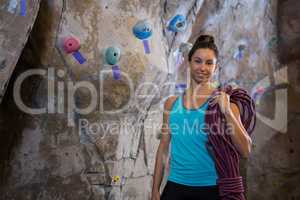 Woman holding rope in fitness studio