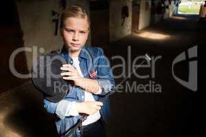 Girl standing in the stable