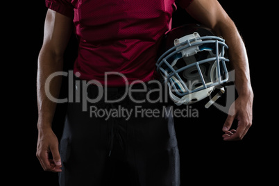 American football player holding a head gear