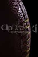 Close-up of texture and stitch on American football