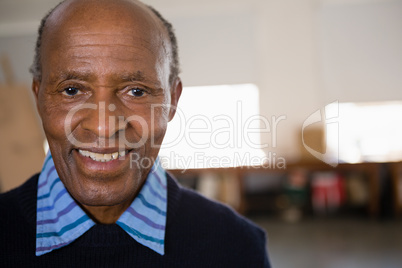 Close up portrait of happy senior man