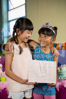 Kids holding gift bag during birthday party