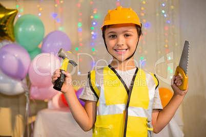 Boy pretending as a worker during birthday party