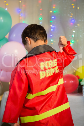 Boy gesturing to the text on protective workwear
