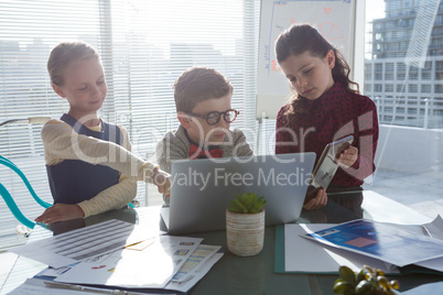 Kids working in office