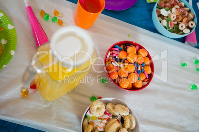 Various confectioneries and juice on a table