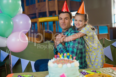 Happy father and daughter celebrating birthday party