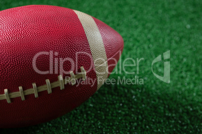 Close-up of American football on artificial turf