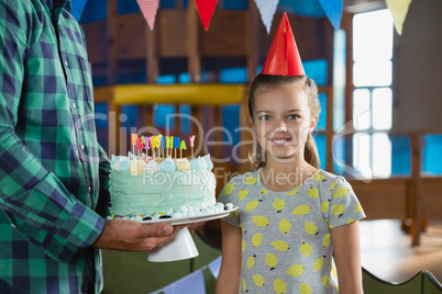 Daughter and father celebrating birthday at home