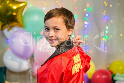 Boy gesturing to the text on protective workwear