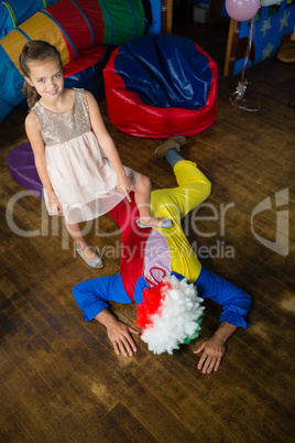 Girl playing with her father at home