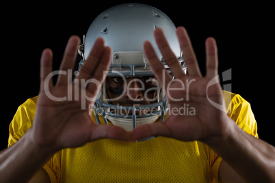 American football player showing hand gestures