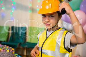 Boy pretending as a worker during birthday party