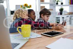 Business people discussing over tablet in office