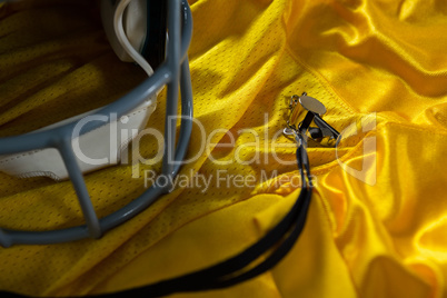 American football jersey, referee whistle and head gear
