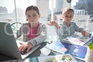 Female coworkers working at desk