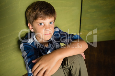 Boy sitting at home