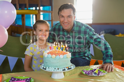 Father and daughter celebrating birthday at home