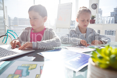 Female colleagues working at desk