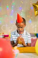 Boy drinking juice during birthday party