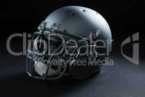 American football head gear on a black background